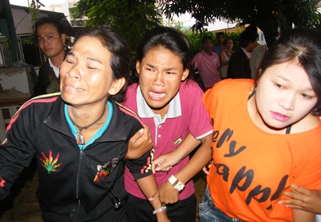 Horrified friends and relatives rush to the scene.